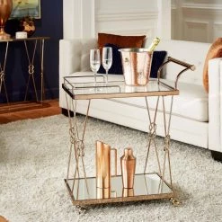 Champagne Gold Finish Reef Knot Frame And Glass Top And Mirror Bottom Bar Cart by HomeSullivan